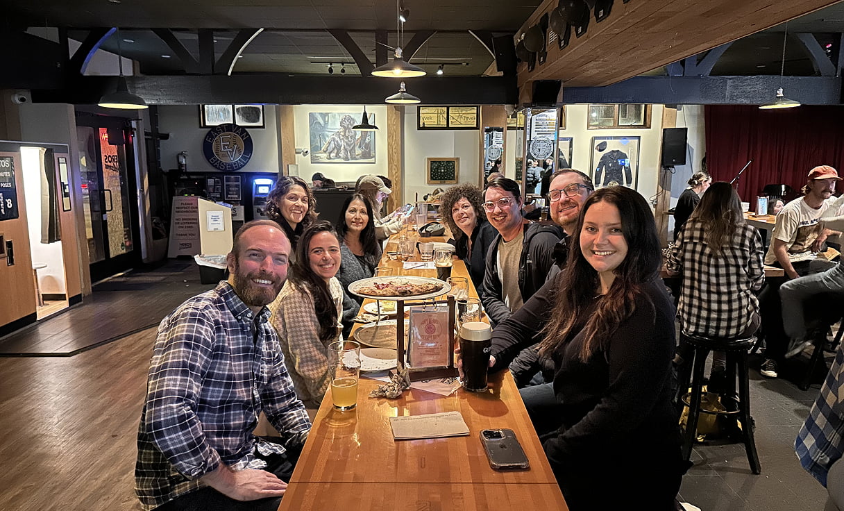 The Vancouver office team eating dinner together.