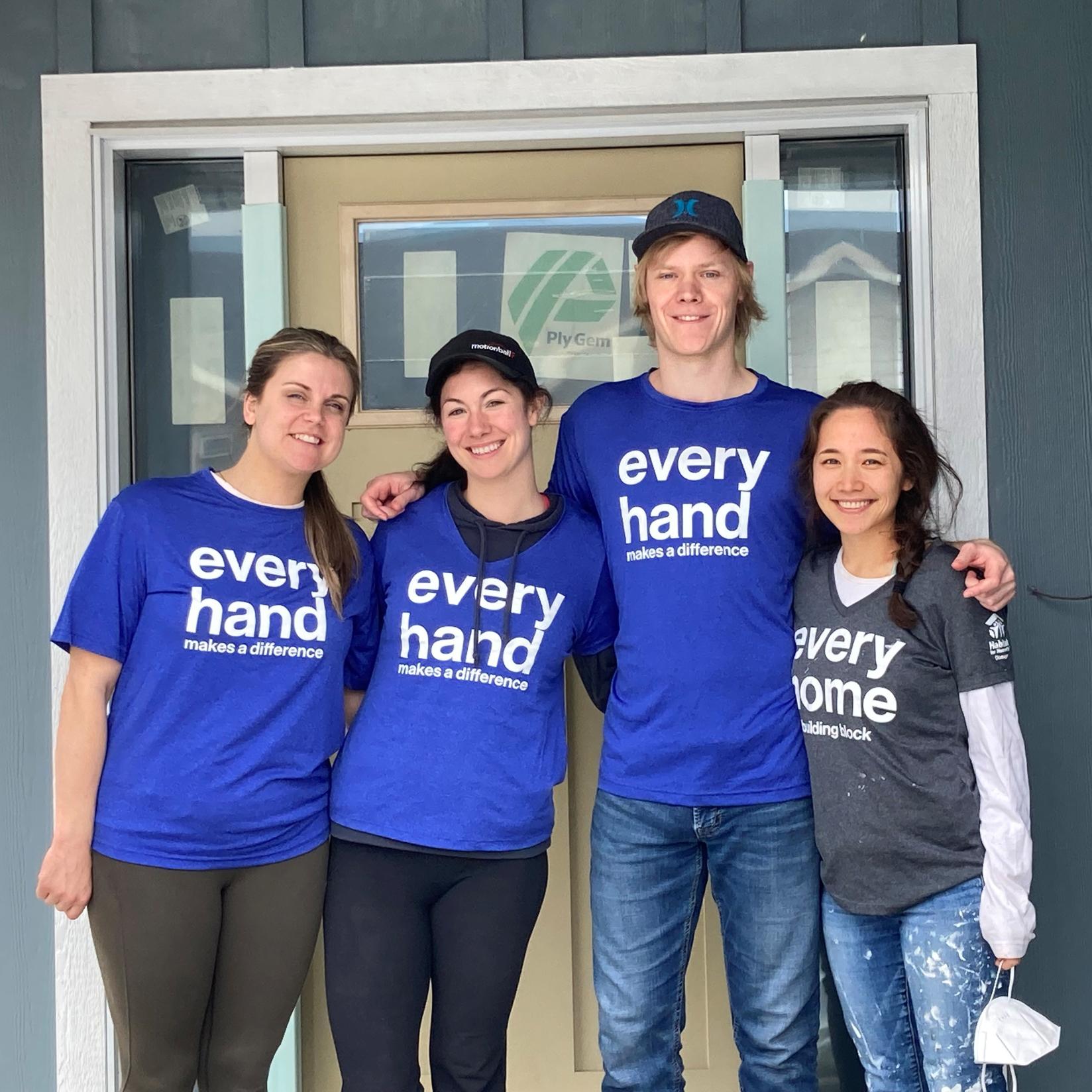 Group of Urban System volunteers wearing shirts that say 'every hand'.